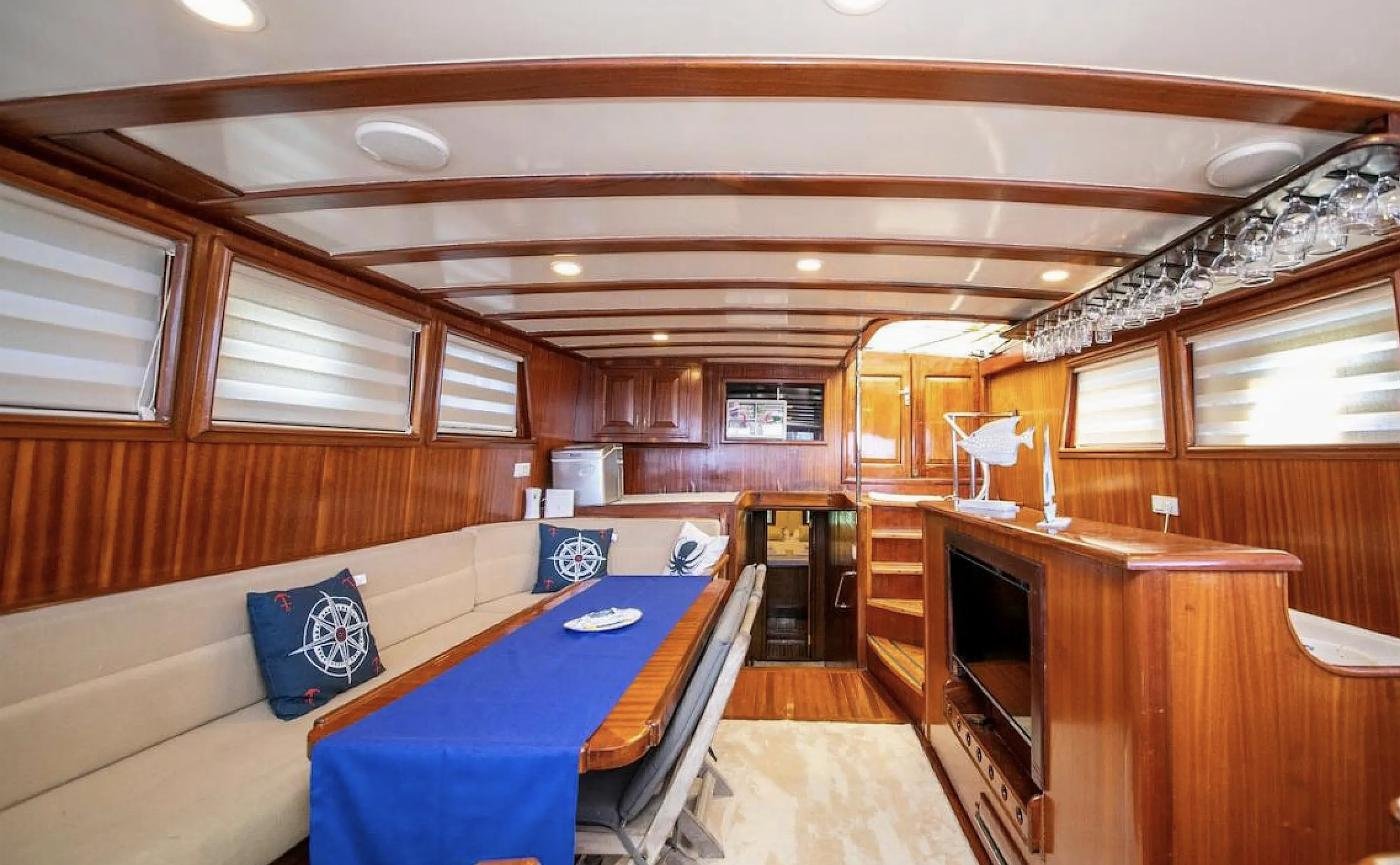 Mahogany-panelled saloon of a luxury gulet charter Selimiye