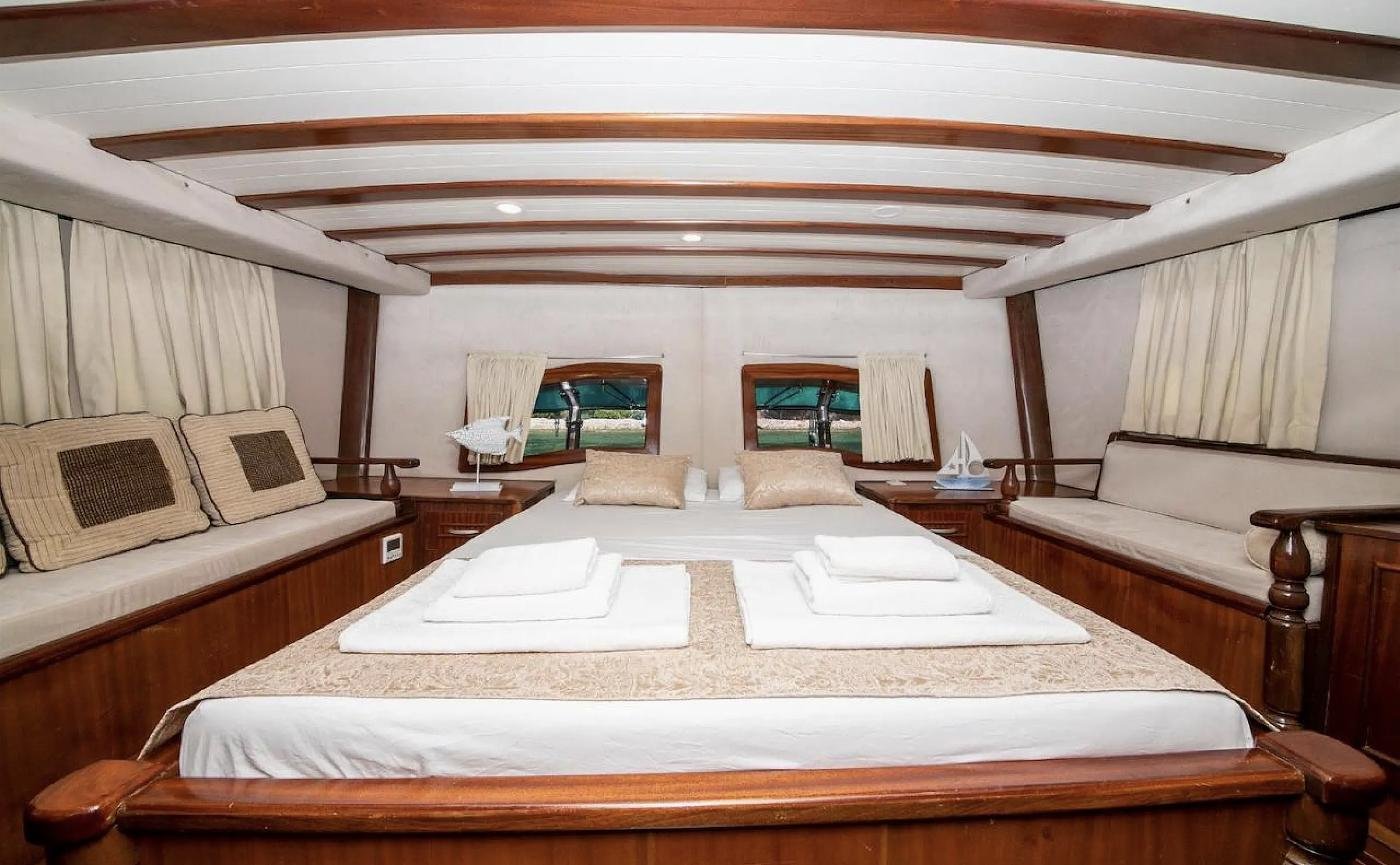 Master cabin with king bed on a luxury gulet charter Selimiye