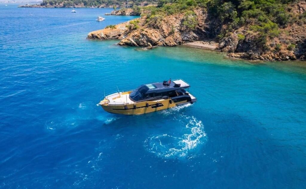Mazu 58 charter Göcek — overhead aerial of the yacht at anchor over clear water