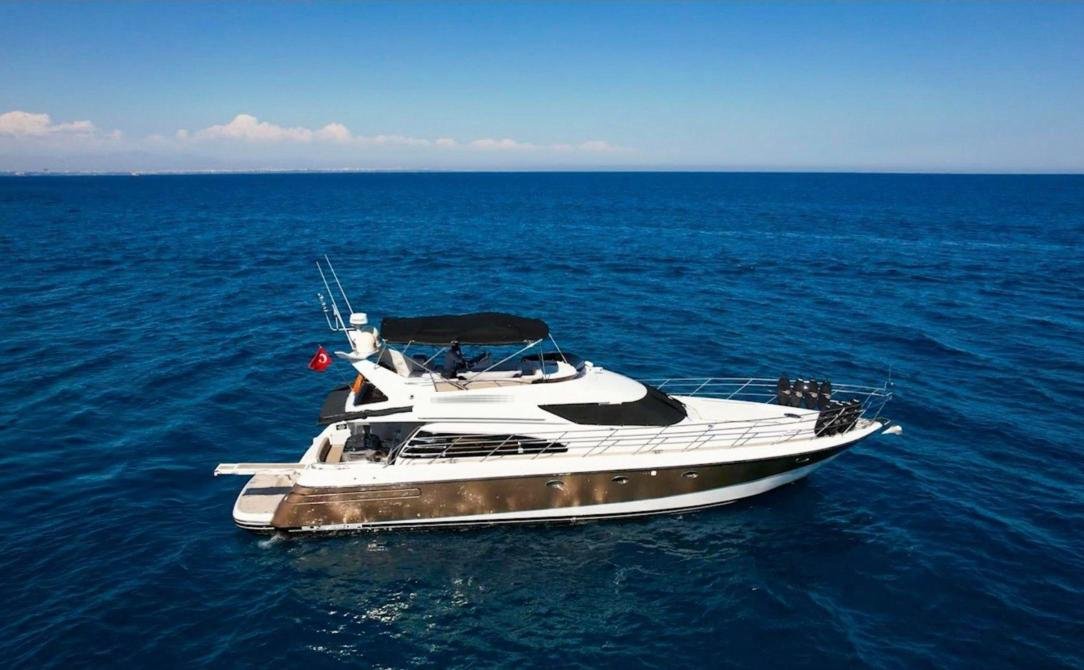 Motor yacht charter Antalya lying on deep blue water off the gulf