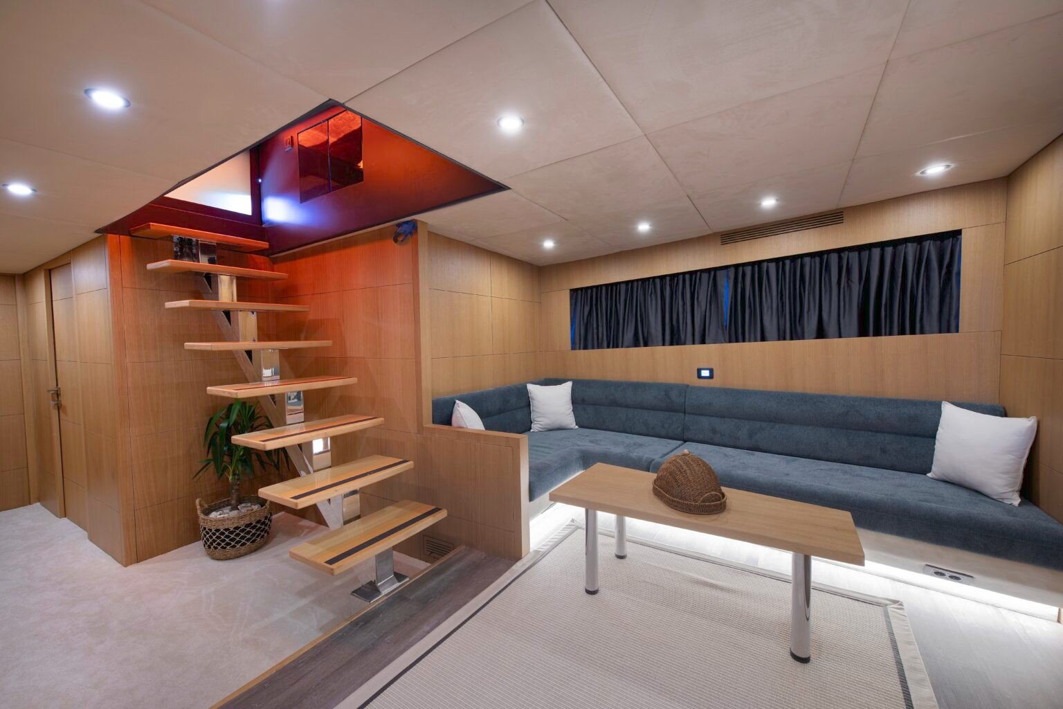 Motor yacht charter Bodrum BE2403 main salon with warm wood joinery