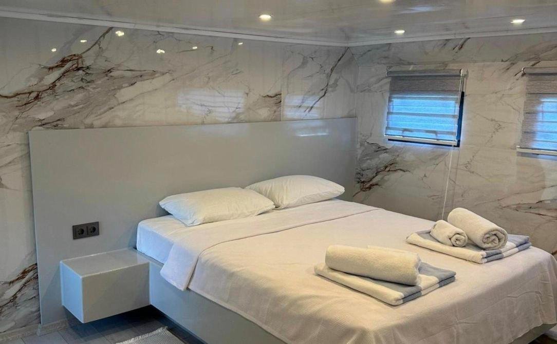 Master cabin with double berth and marble panelling