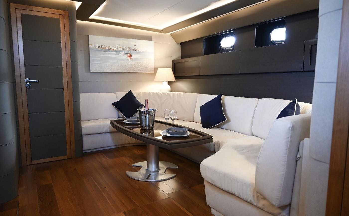 Saloon looking forward to the cabin lobby aboard a 23m motor yacht