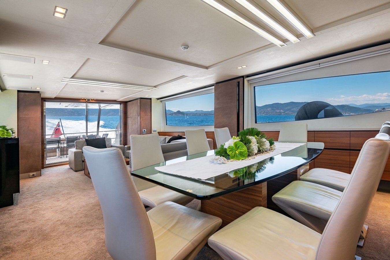 Formal dining table in the saloon of a Peri 37 charter Göcek with sea views on both sides