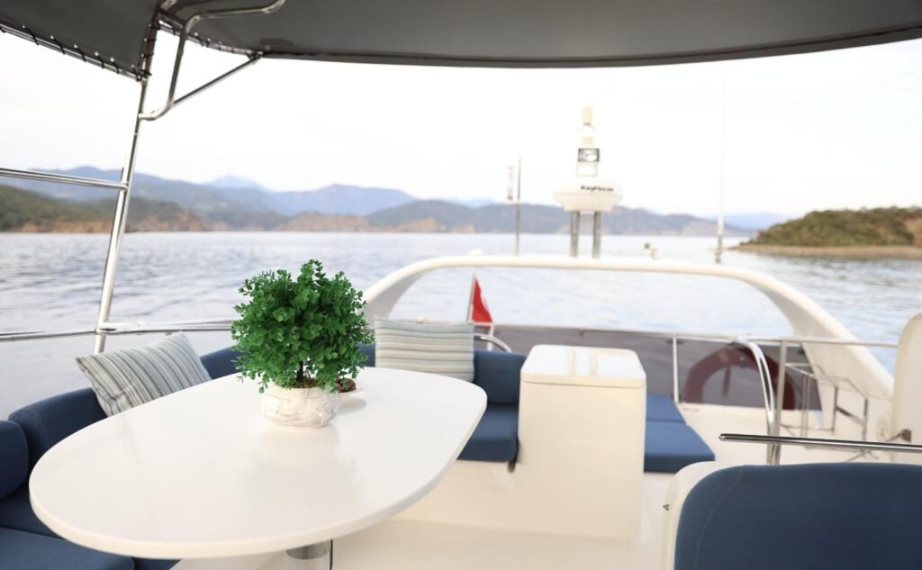 Flybridge dining with a cove view on a Rodman 41 charter Gocek