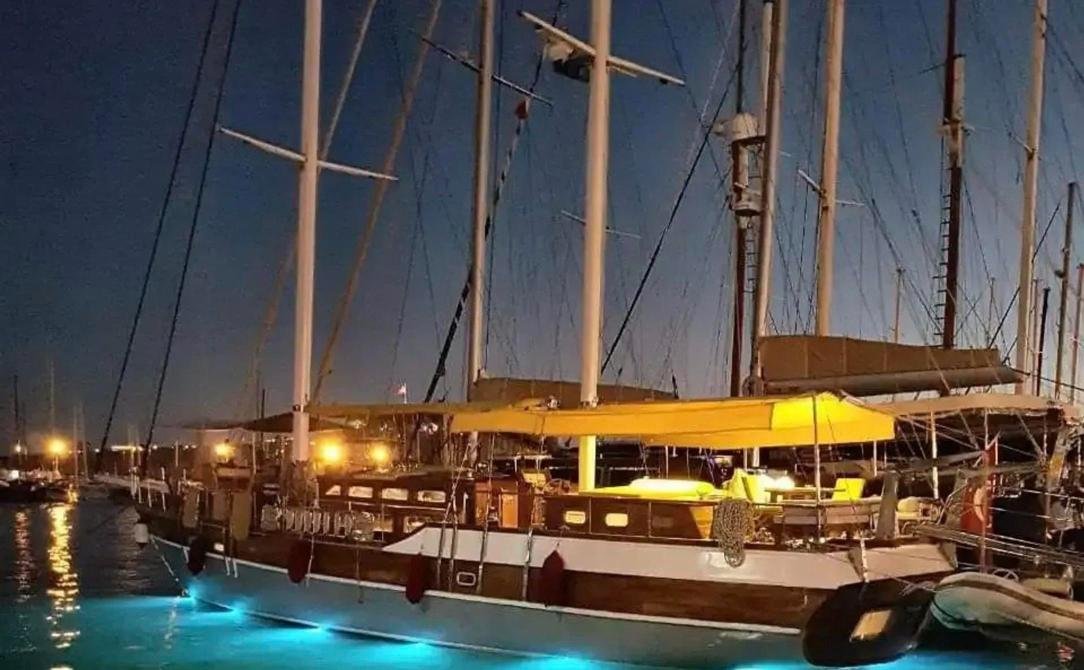 Romantic gulet charter Bodrum - gulet lit at dusk with underwater lights