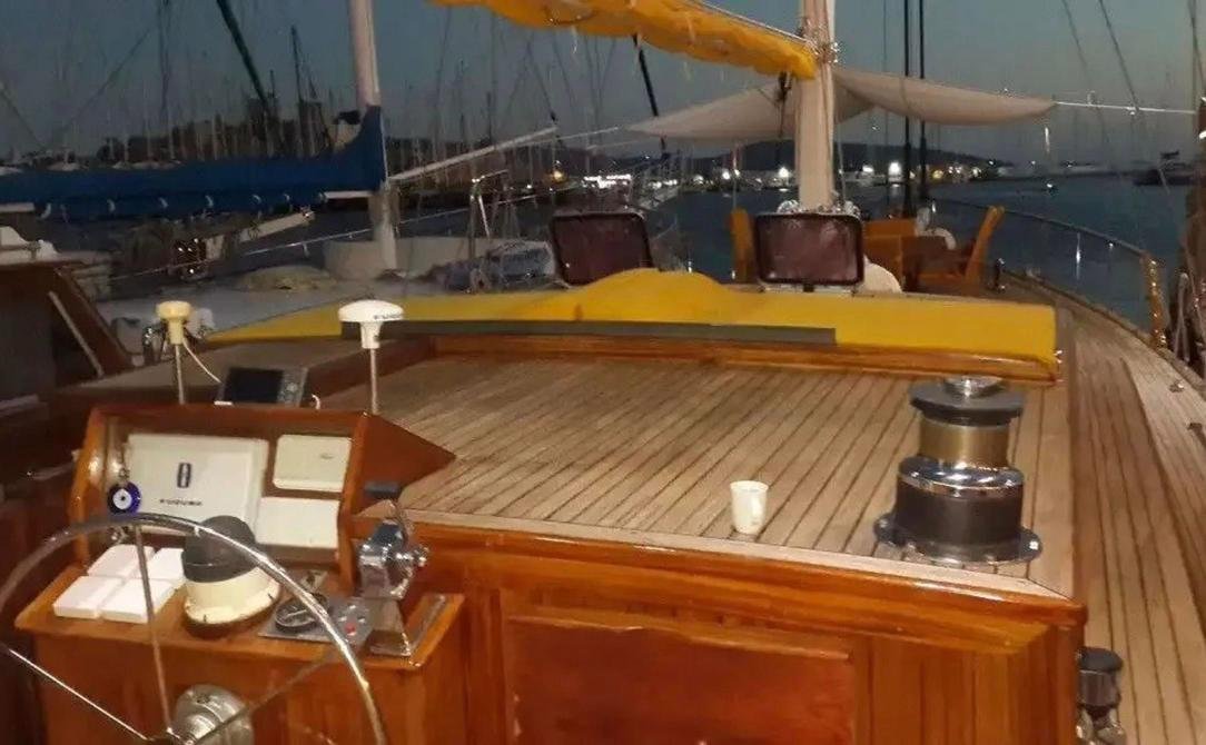Romantic gulet charter Bodrum - helm station and teak side deck at dusk