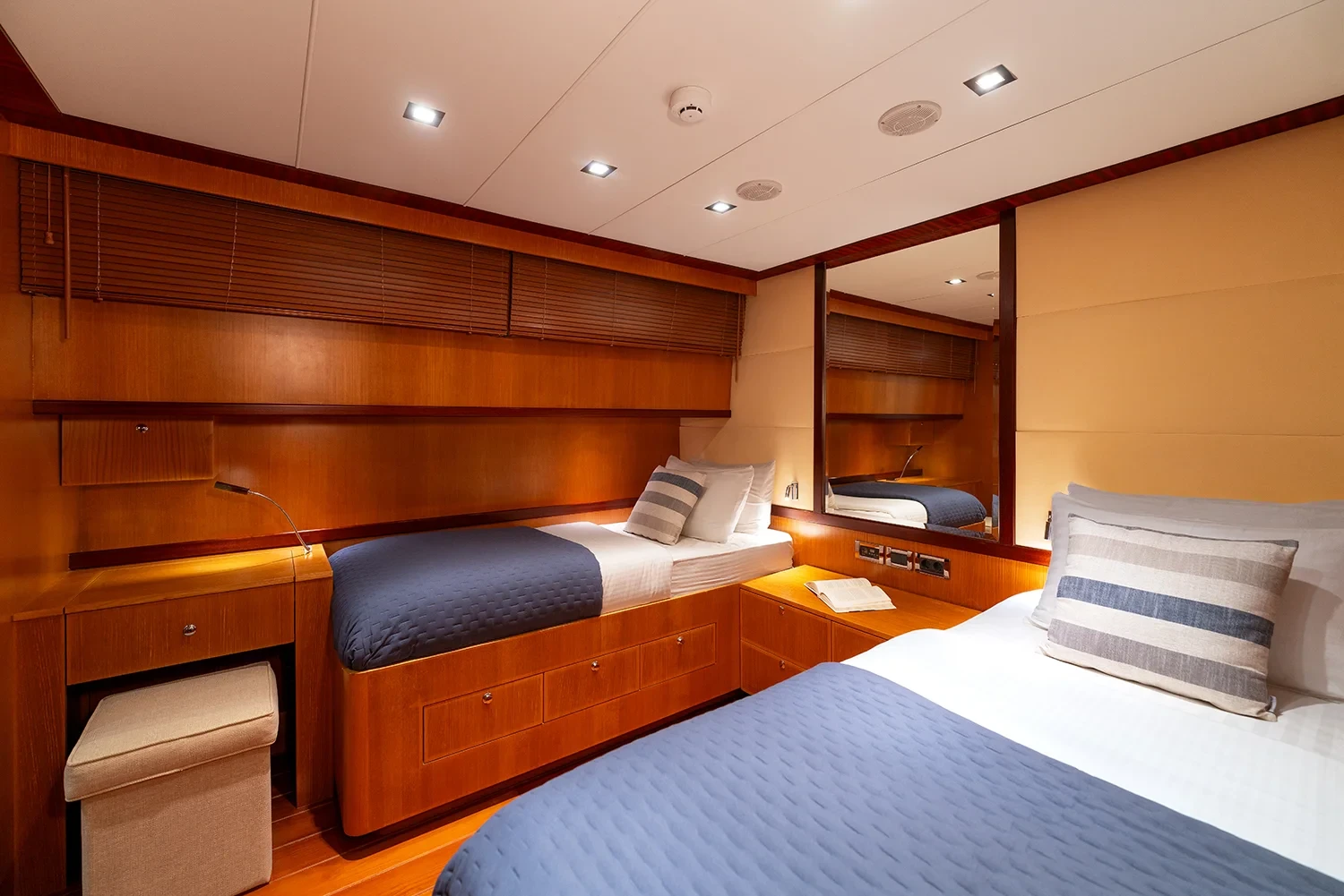 Second angle of a twin cabin aboard a sailing yacht charter in Bodrum with reading light and bedside storage
