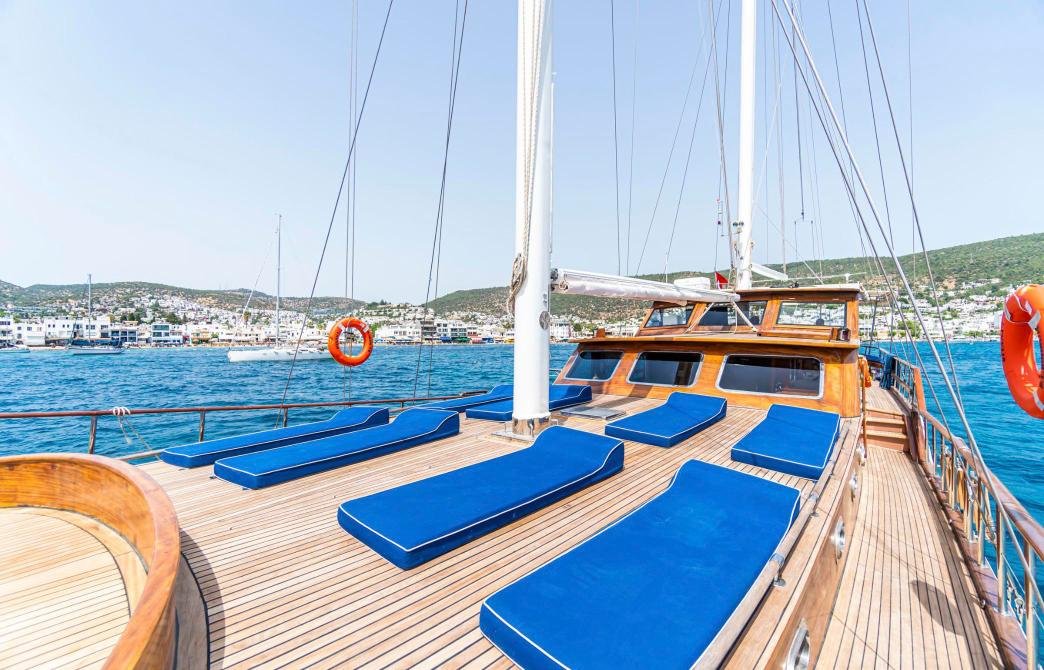 Foredeck sunpads on teak on a small group gulet charter Bodrum