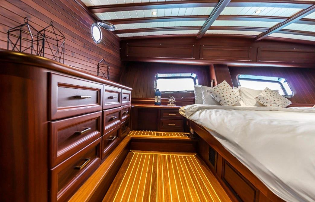 Master cabin with mahogany joinery on a small group gulet charter Bodrum