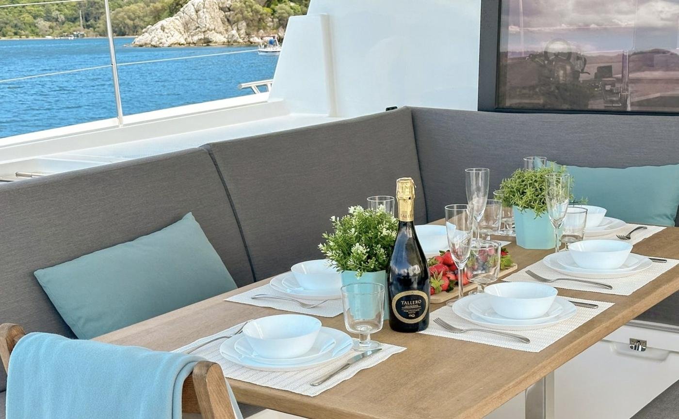 Tanna 47 charter Marmaris - cockpit dining table laid for lunch at anchor