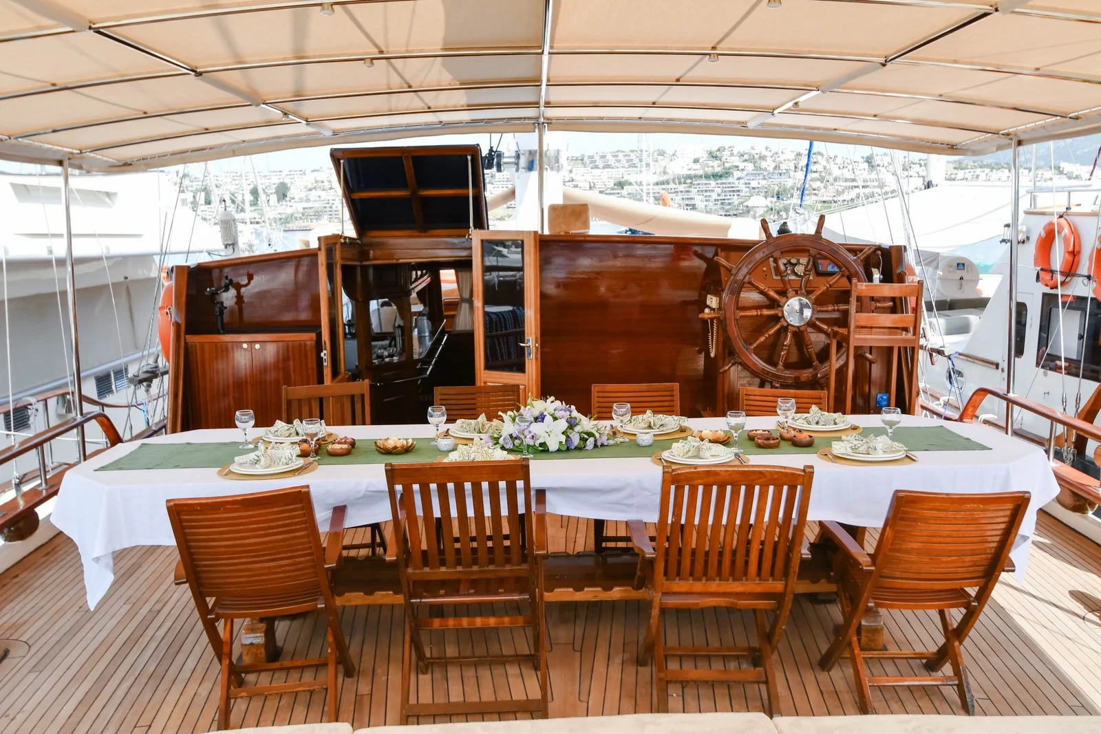 SW3001 30m traditional gulet charter Turkey aft deck dining beside the traditional ship's wheel