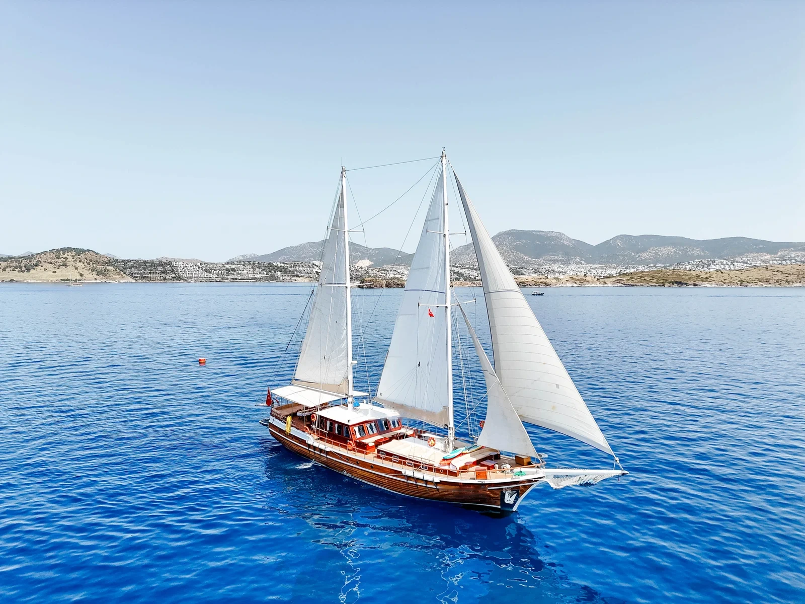 SW3001 30m traditional gulet charter Turkey under full sail, broadside view off the Bodrum coast
