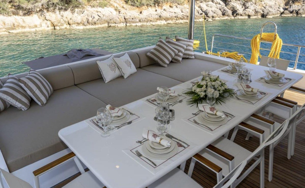Aft deck dining table laid for lunch