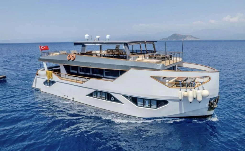 Profile view of a 28-metre trawler motor yacht for charter on the Fethiye coast
