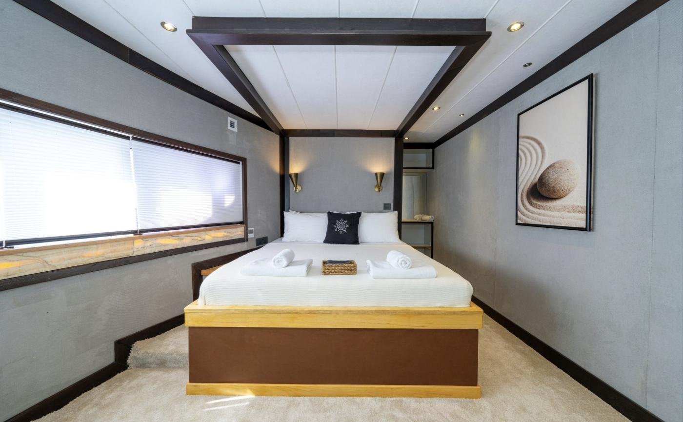 Full-beam master cabin aboard a luxury trawler yacht charter in Fethiye