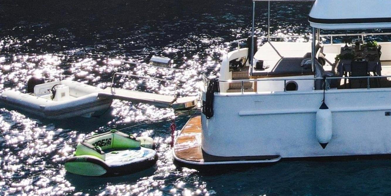 Swim platform with tender and towable toys on a Fethiye trawler yacht charter