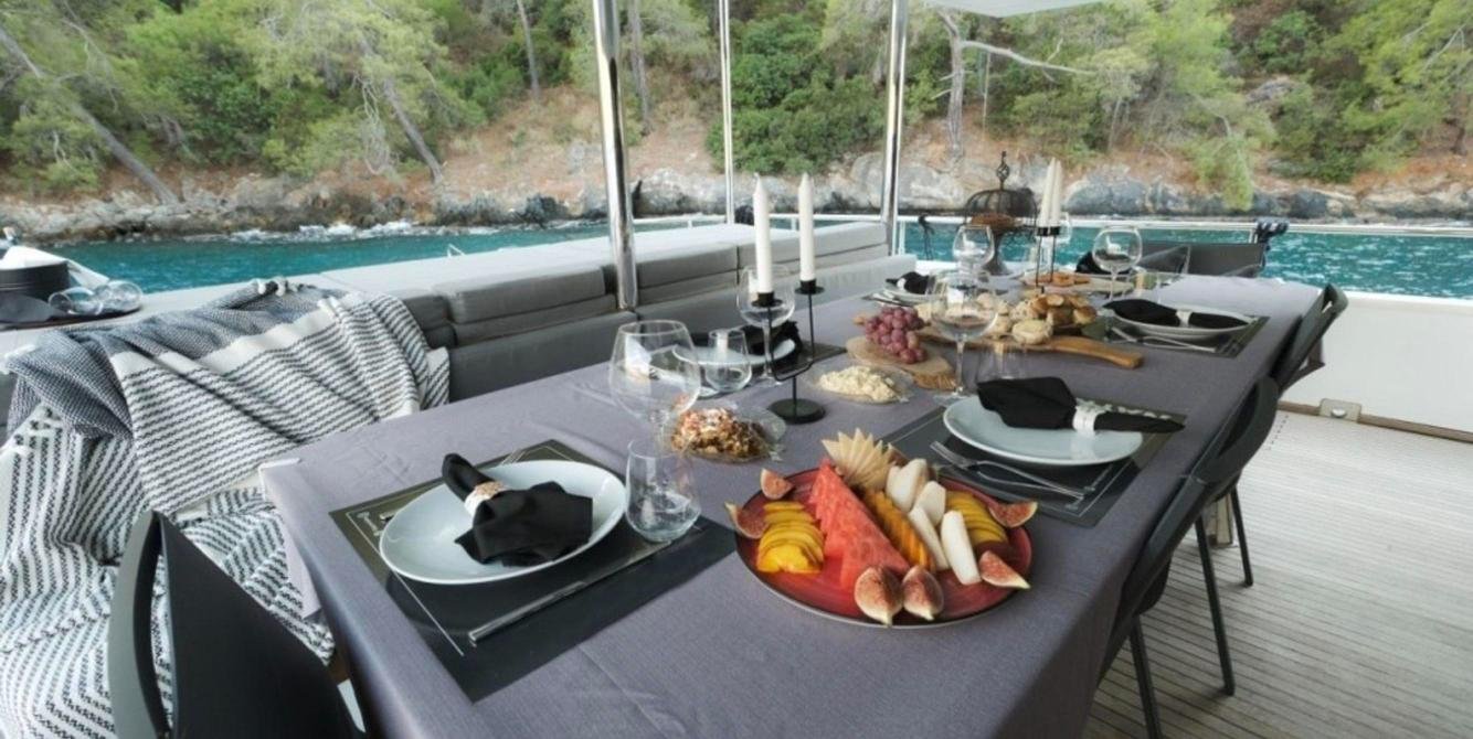 Al fresco aft-deck dining on a trawler yacht charter in Fethiye