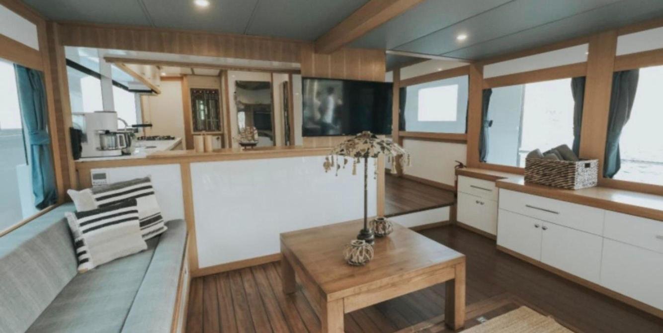 Oak-panelled saloon of a trawler yacht charter in Fethiye