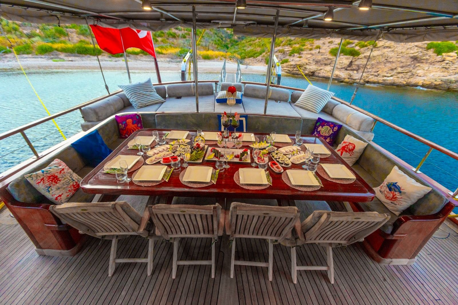 Aft deck dining table set for twelve on a Turkish gulet