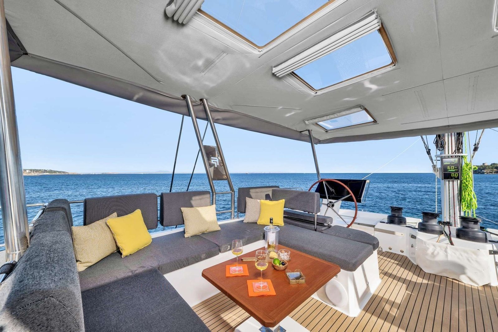Alegria 67 charter Ibiza catamaran flybridge lounge and helm