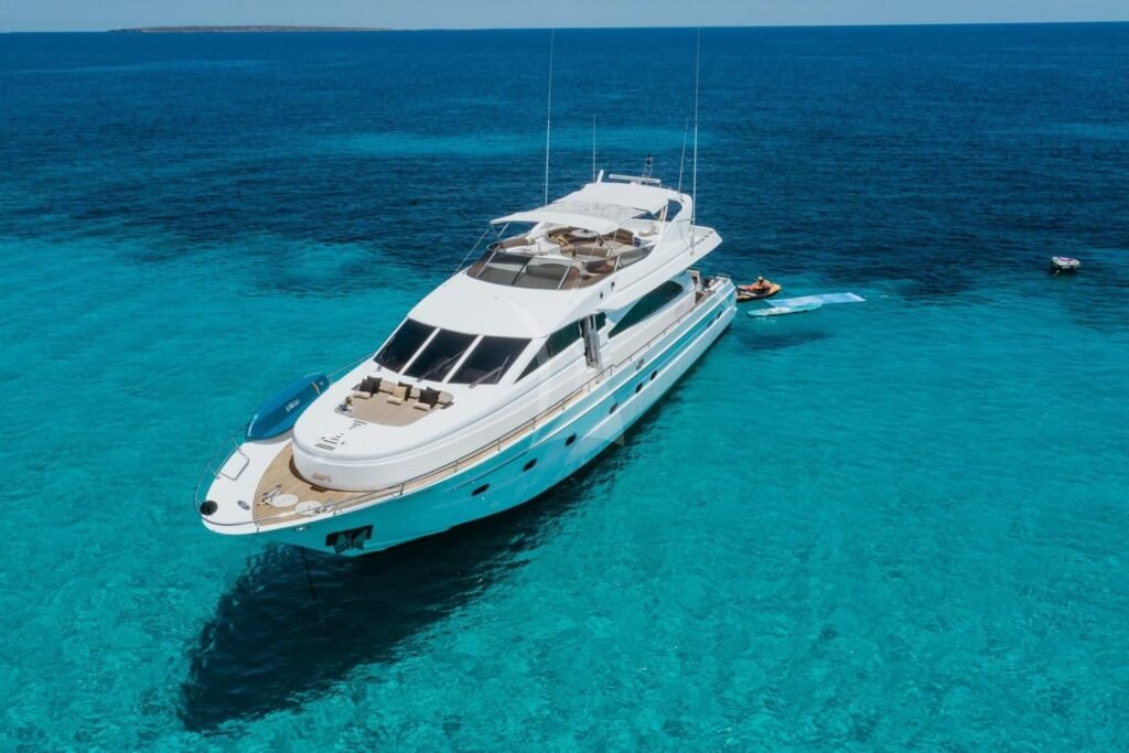 Astondoa 82 GLX charter Ibiza motor yacht at anchor in clear Balearic water
