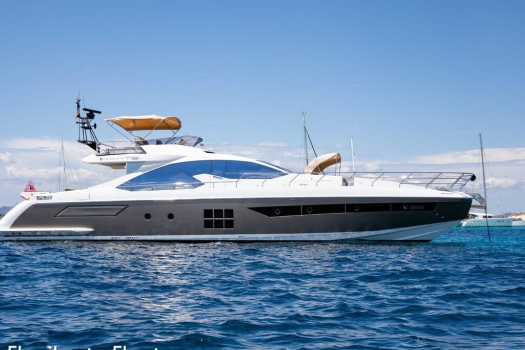 Azimut S7 charter Ibiza – the sport flybridge yacht at anchor off Formentera