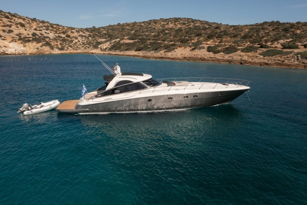 Baia Azzurra 63 motor yacht charter Mykonos at anchor in a Cycladic cove