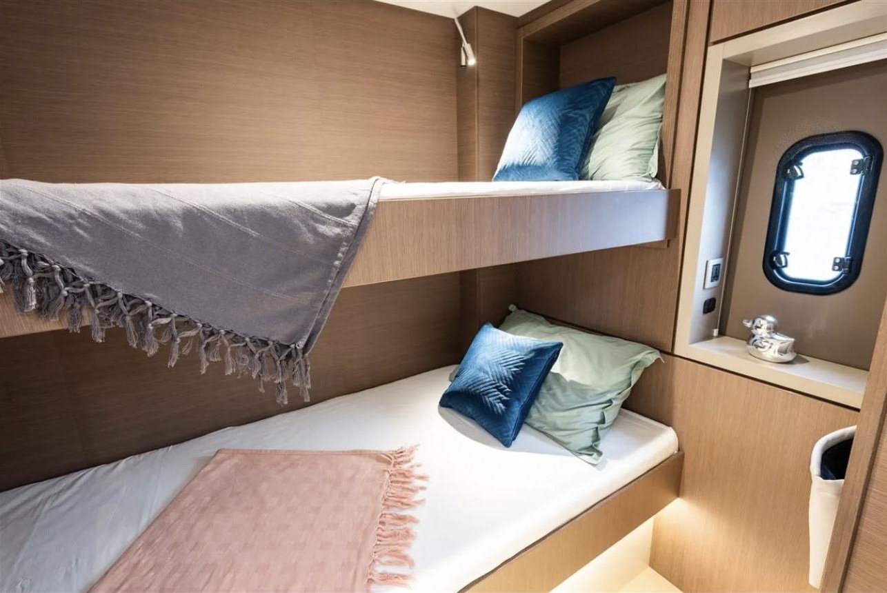 Luxury catamaran charter Fethiye - twin bunk cabin with reading lights and a portlight