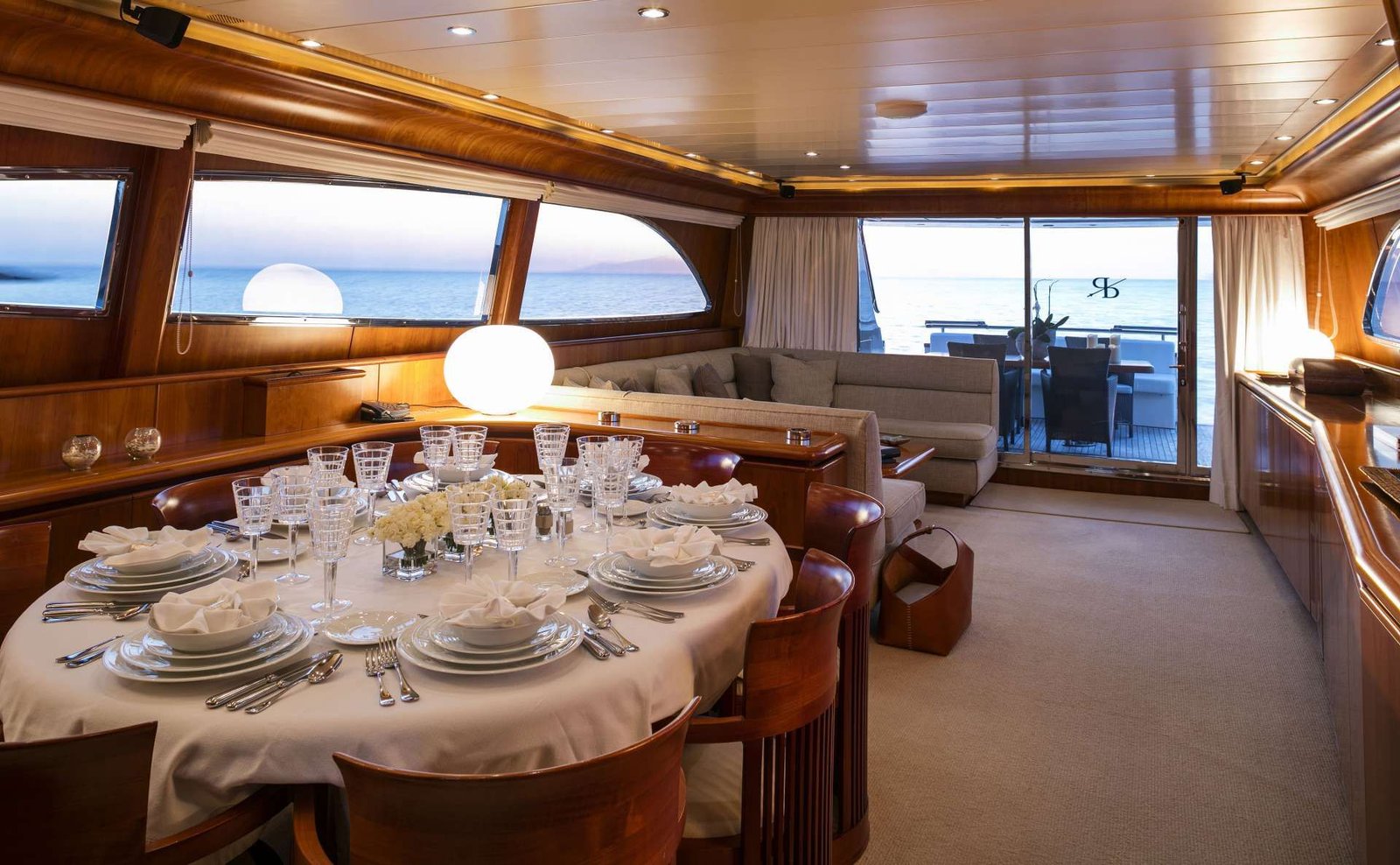 Main saloon with lounge seating on a Canados charter yacht