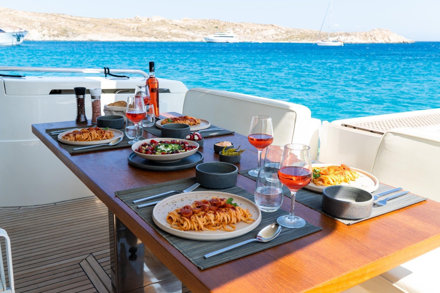 Deck table laid for lunch on a Ferretti 53 motor yacht charter Mykonos