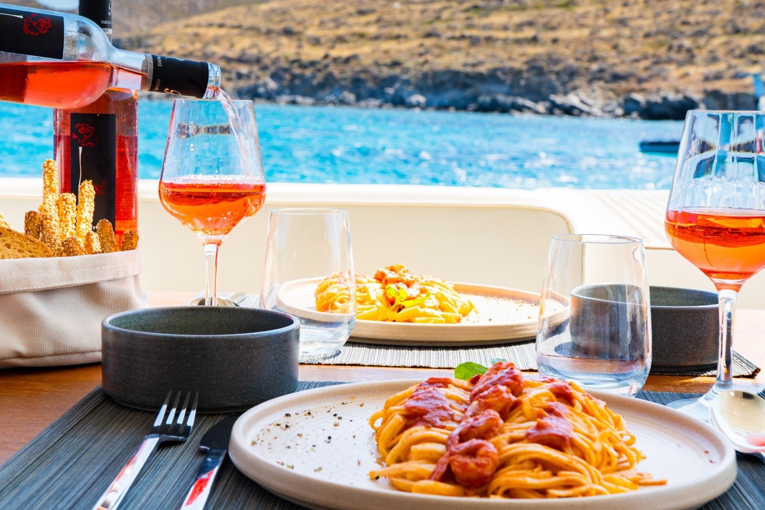 Cycladic lunch served on board a Ferretti 53 motor yacht charter Mykonos