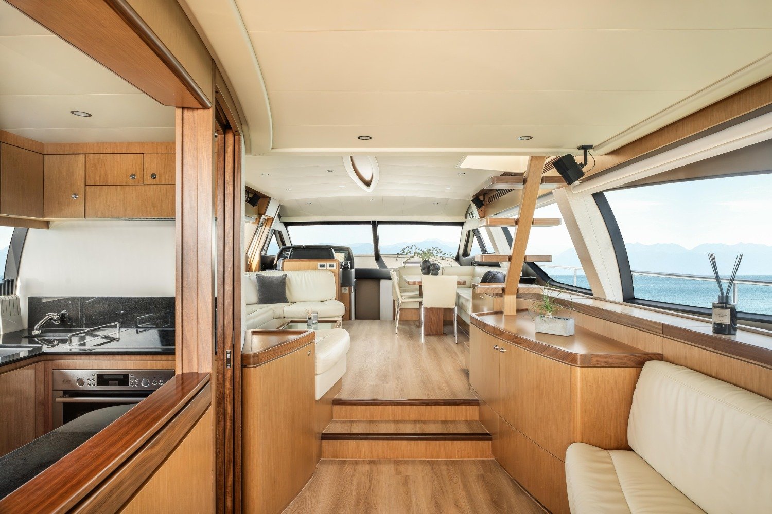 Saloon looking forward to the lower helm on a Ferretti 630 motor yacht charter Mykonos