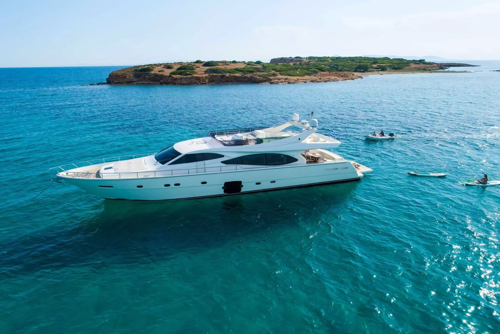 Ferretti 780 motor yacht charter Athens at anchor off a Greek islet