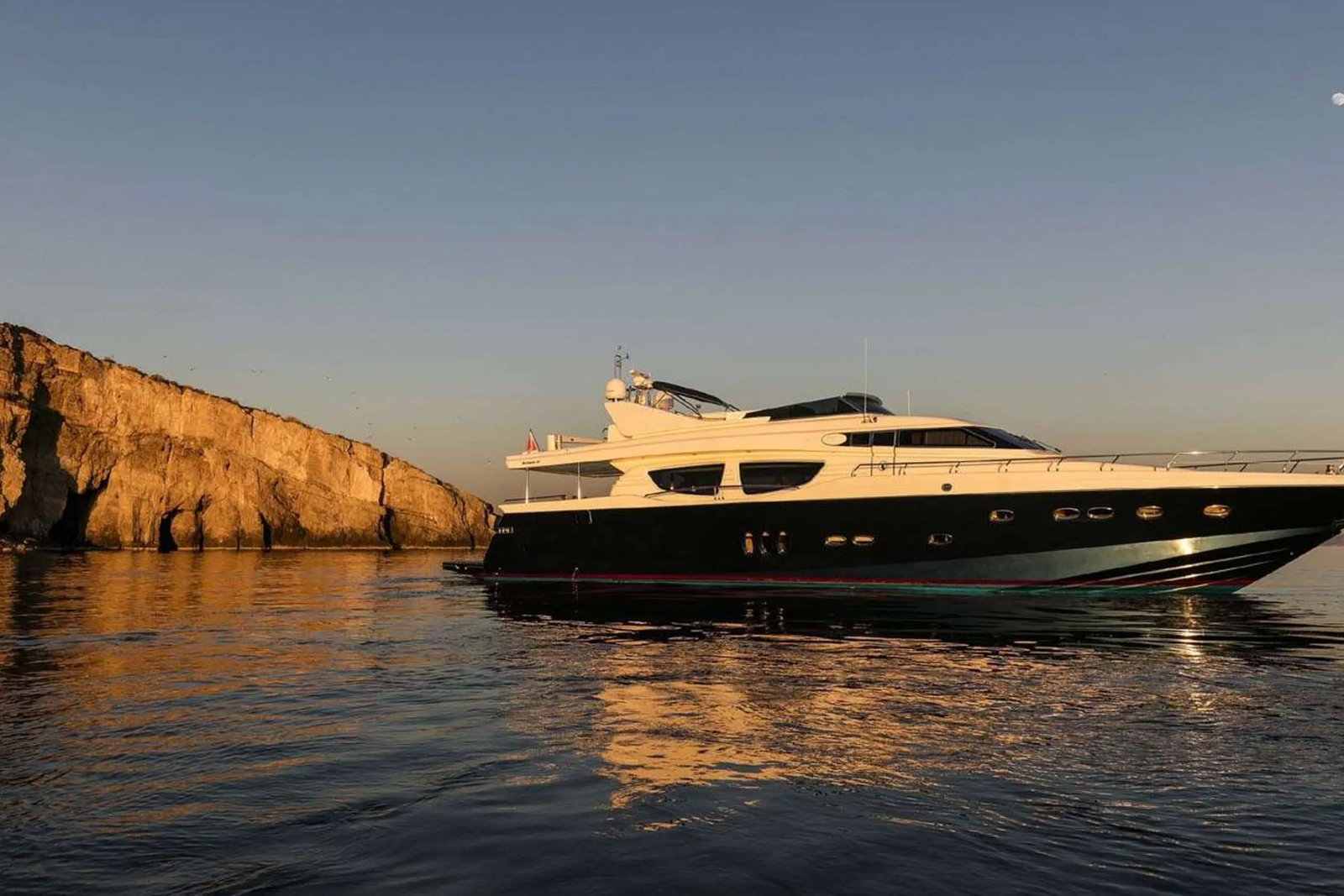 Posillipo Technema 85 motor yacht charter Athens at anchor at sunset
