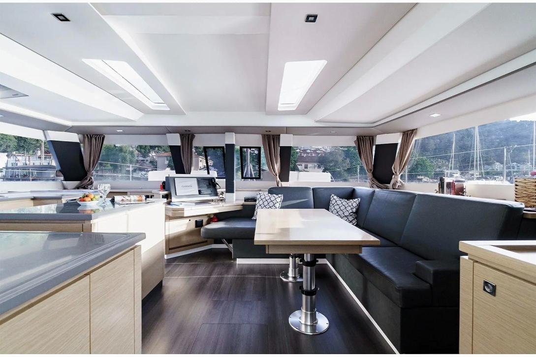 Saloon dinette and navigation station on a Saba 50 charter catamaran