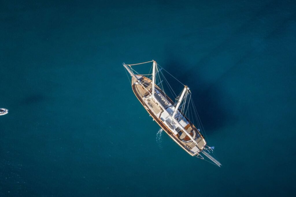 Su Marine 104 charter Athens motor sailer seen from the air at anchor in the Cyclades