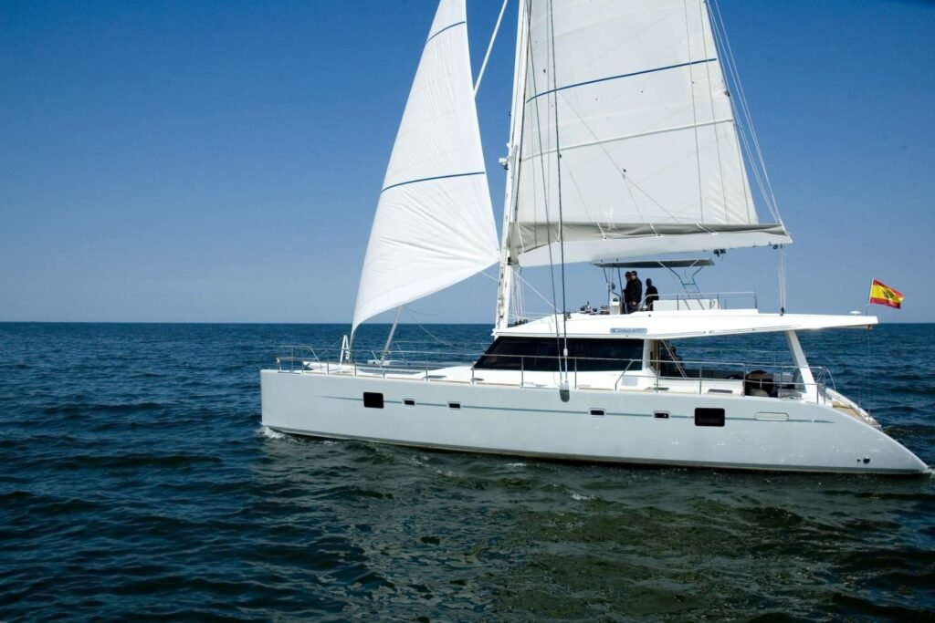 Sunreef 62 charter Ibiza luxury crewed catamaran sailing profile in the Balearic Islands