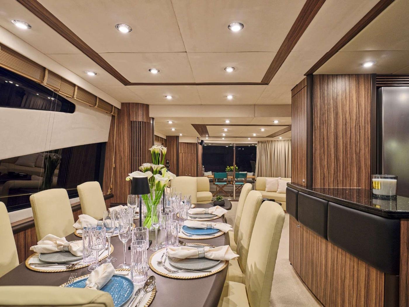 Formal saloon dining table inside the Sunseeker 75 charter Athens yacht