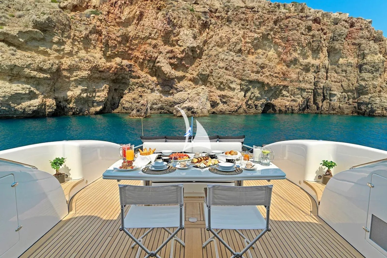 Tecnomar Velvet 83 motor yacht charter Athens aft deck dining table