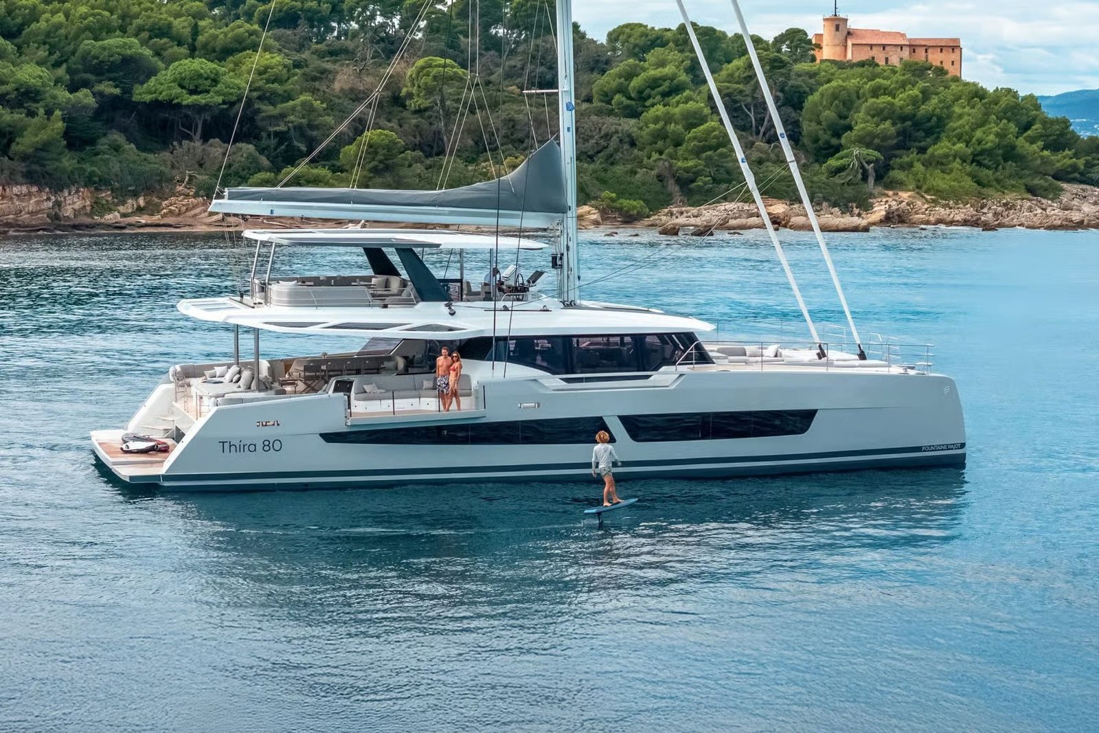 Thira 80 catamaran charter Greece profile at anchor in a sheltered bay