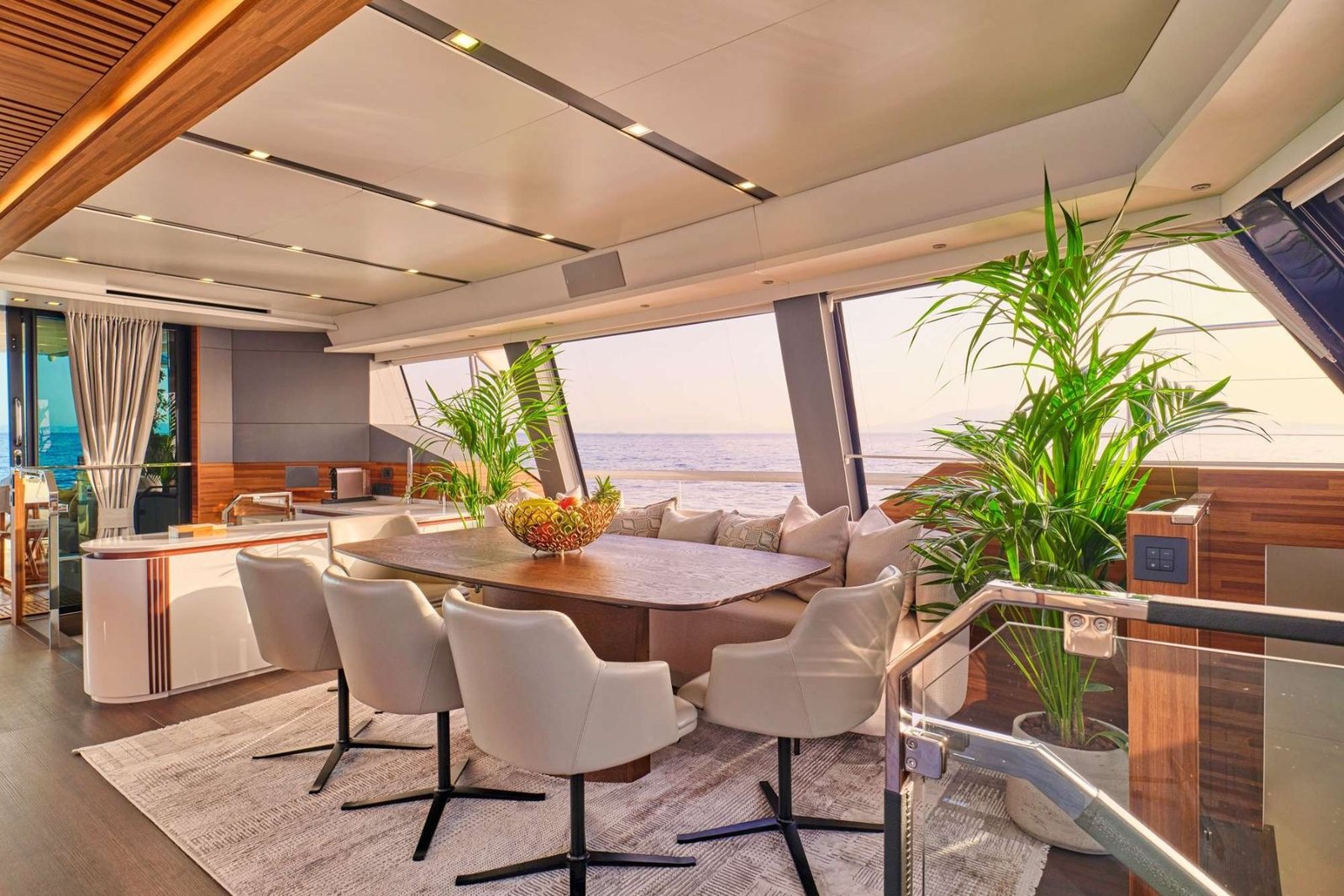 Thira 80 catamaran charter Greece main saloon with panoramic glazing and teak ceiling